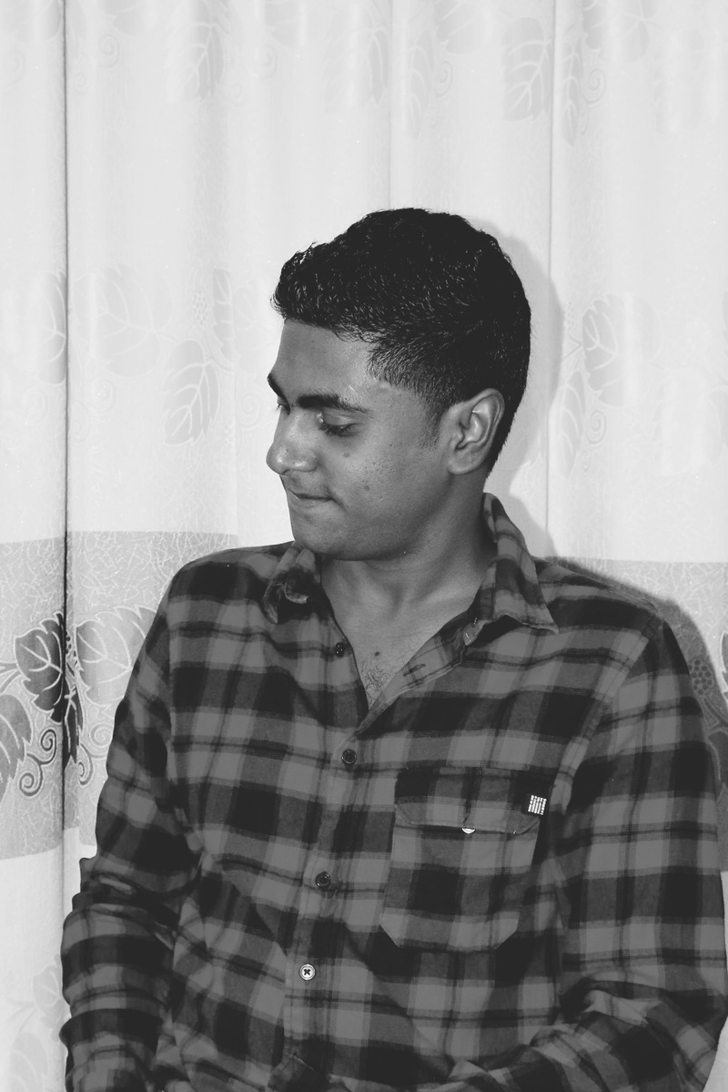 casual clothing, curtain, contemplation, boy, wall - building feature, looking, real people, maldivian, checked pattern, hairstyle, mid adult, maldives
