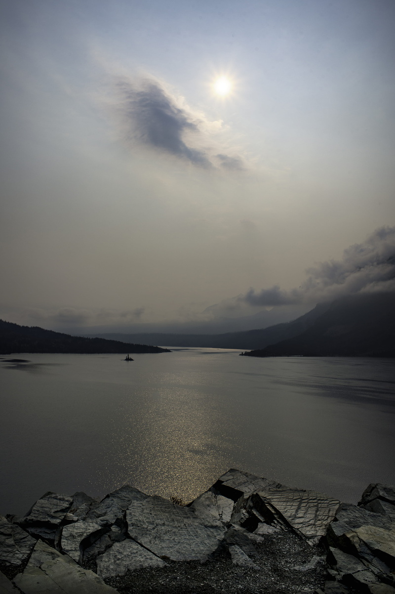 tranquility, tranquil scene, glacier national park, no people, mountains, clearing storm, idyllic, smoke, island, sun, nature, rock - object, solid, sea
