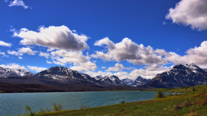 non-urban scene, saint mary lake, mountain, beauty in nature, landscape, mountain peak, 2K, snowcapped mountain, sky, travel destinations, outdoors, mountain range