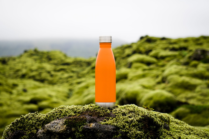 nature, bottle, beauty in nature, water, north, orange, solid, explorer, outdoors, green color, rock, land, freshness, drink, driver, face, camp, refreshment
