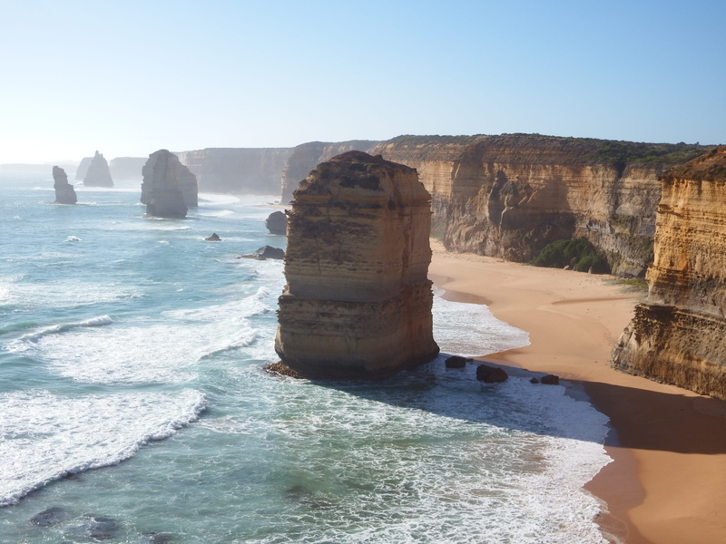 shoreline, clear sky, coast, tranquility, sea waves, waves, person, surrouned, rock formation, islet, day, great ocean road, outdoors, ocean, cliff, twelve apostles