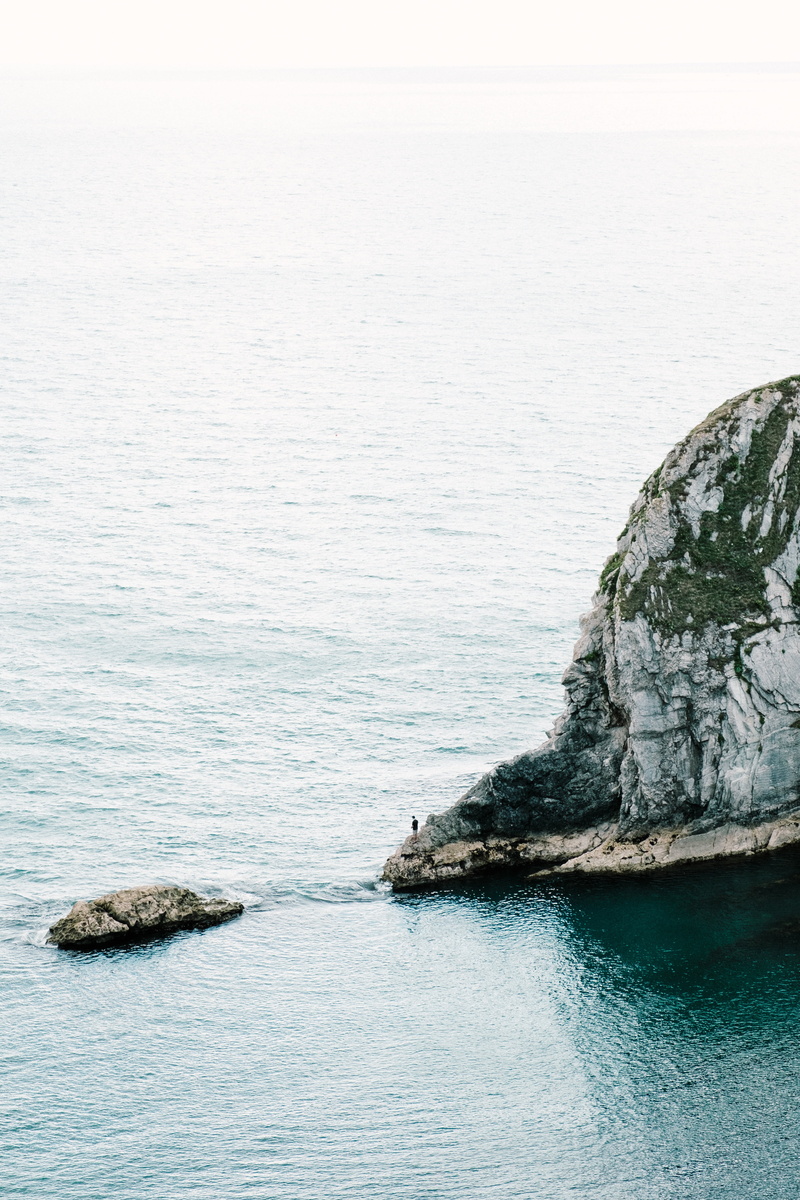 rock - object, islet, no people, horizon over water, day, nature, mammal, water, idyllic, cliff, animal themes, ocean, island, outdoor, daytime, scenics - nature