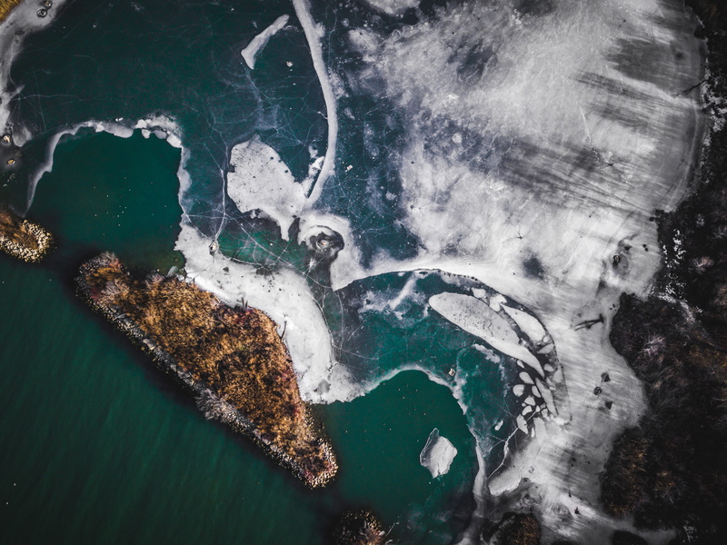 ice, high angle view, water, scenics - nature, islet, land, 4K, winter, body, satellite view, aerial, environment, nature, aerial view, sea, motion, power in nature