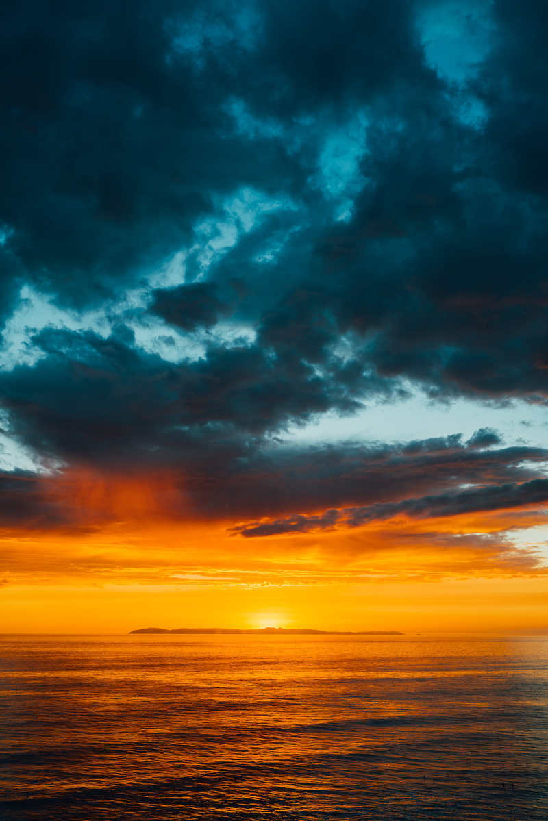 covering, beauty in nature, catalina island, bright, outdoors, overcast, sea, dramatic sky, scenics - nature, orange color, horizon over water, ominous