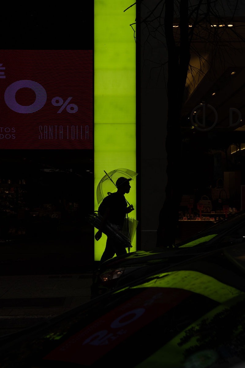 man, spoke, one person, city life, alphabet, light, logo, clinic, laser, city, text, flare, arcade game machine, communication, machine, real people, built structure