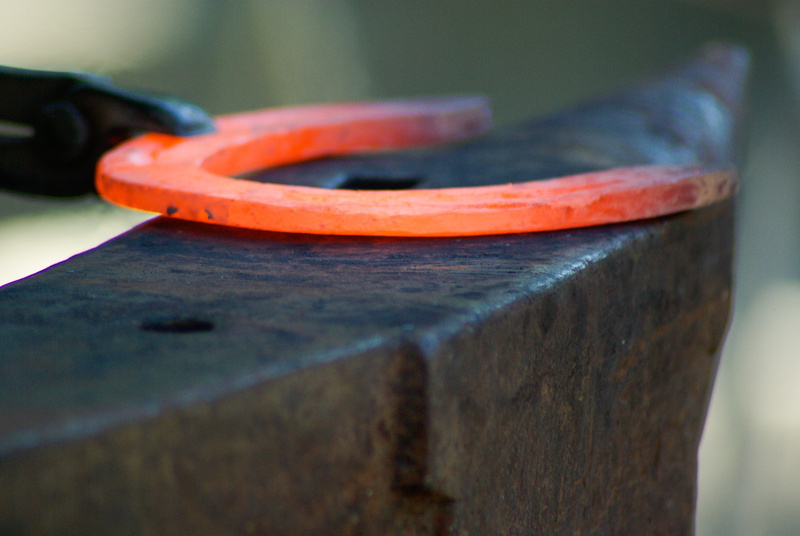 indoors, 4K, red, wood - material, still life, communication, craft, single object, anvil, preparation, making, horseshoe, blacksmith, selective focus