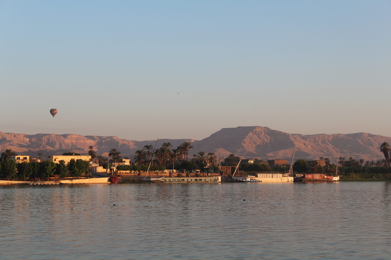 no people, lake, tree, sky, luxor, outdoors, waterfront, transportation, beauty in nature, tranquil scene, mode of transportation, architecture, nile, nautical vessel