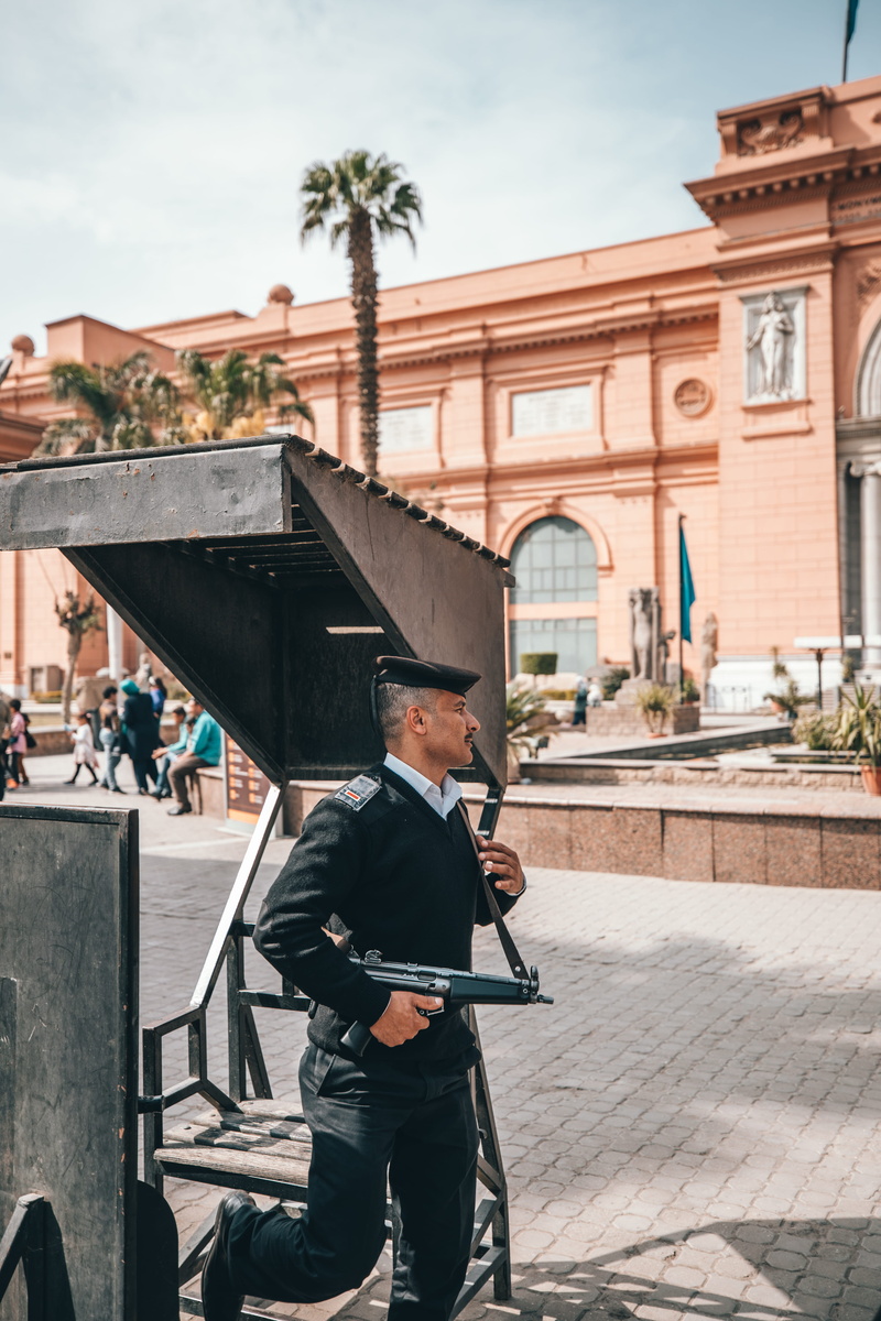 outdoors, nature, three quarter length, clothing, milita, day, man, guard, person, soldier, apparel, standing, built structure, travel, building exterior