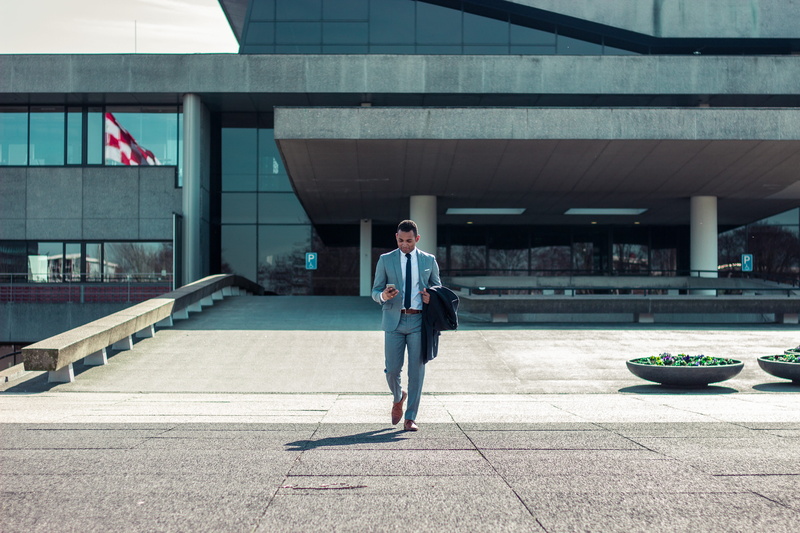 building, young men, connection, day, only men, outdoors, coat, business, one person, a gray, adult, standing, building exterior, office building exterior