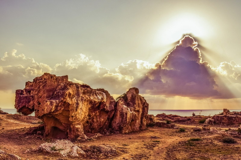 outdoors, sunbeam, historic, clouds, paphos, cloud - sky, rock, ancient, rock - object, sunset, scenics - nature, water, archaeology, beauty in nature