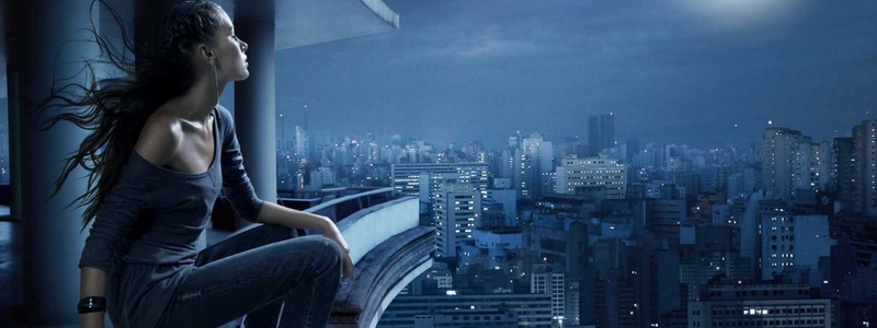 urban skyline, young adult, looking at view, dual screen   images, women, contemplation, one person, building, illuminated, built structure, sky, skyscraper