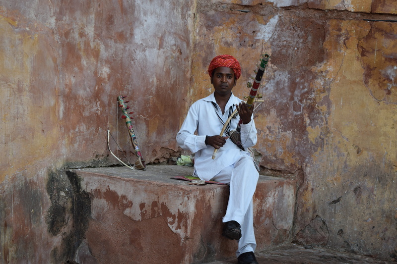 standing, Incredible India, musical instrument, wall - building feature, day, mature men, aamer fort, three quarter length, arts culture and entertainment