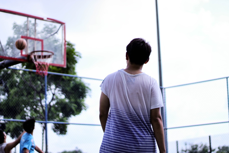 focus on foreground, playing, boys, rear view, man, sky, team sport, outdoors, game, day, basketball, sport, court, basketball - ball, people, waist up