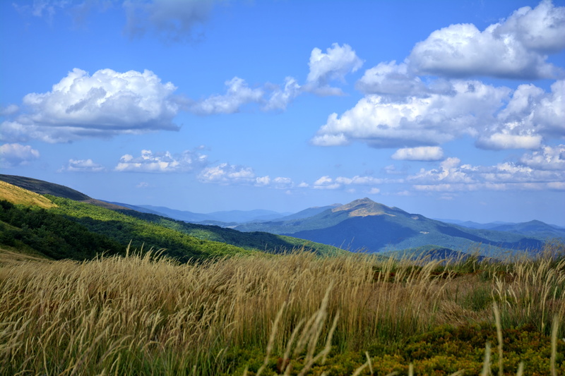 mountain range, non-urban scene, beauty in nature, sky, tarnica, field, no people, mountains, cloud - sky, tour, bieszczady, land, environment, grass, landscape