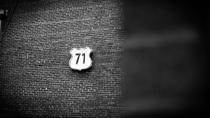 bathroom, photo, street, minim, seventy one, highway, black and white, no people, grayscale, representation, brick, information sign, sign, 71, signage