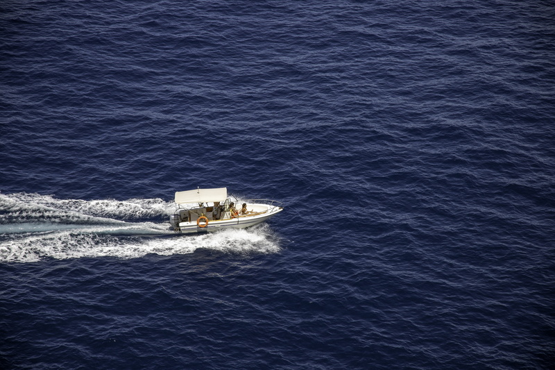 mode of transportation, motion, wake - water, wave pattern, blue water, speed, aerial, boat, waterfront, no people, photography, speedboat, freighter, high angle view
