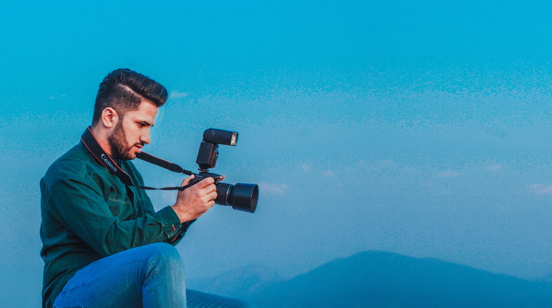 camera, mid adult, mid adult men, retro styled, technology, blue, capturing, middle eastern, camera - photographic equipment, monochrome, camera gear, holding