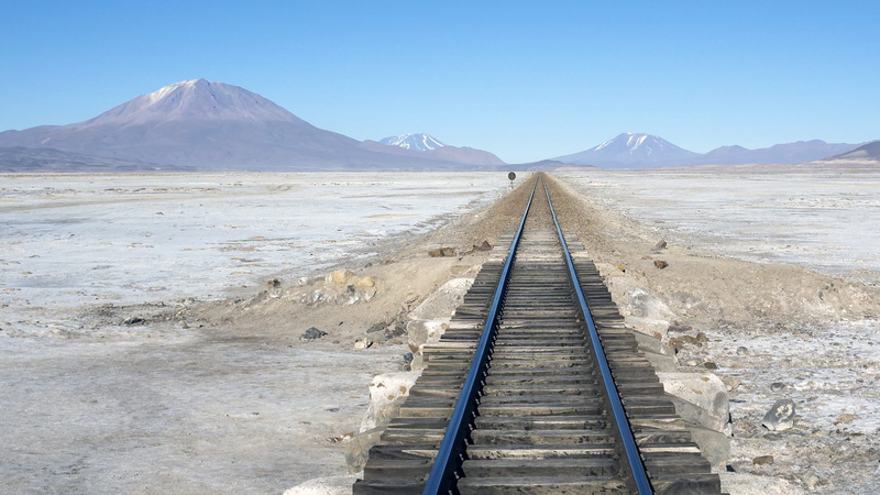 beauty in nature, brown, desert, railing, summit, day, bolivium, empty, railroad, direction, no people, track, landscape, mountain peak, railtrack, sky