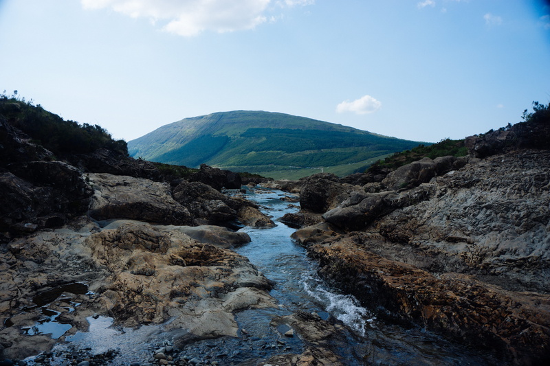 sky, non-urban scene, 5K, rock, flowing water, rock - object, tranquility, outdoors, the fairy pools, no people, landscape, cloud - sky, solid, water