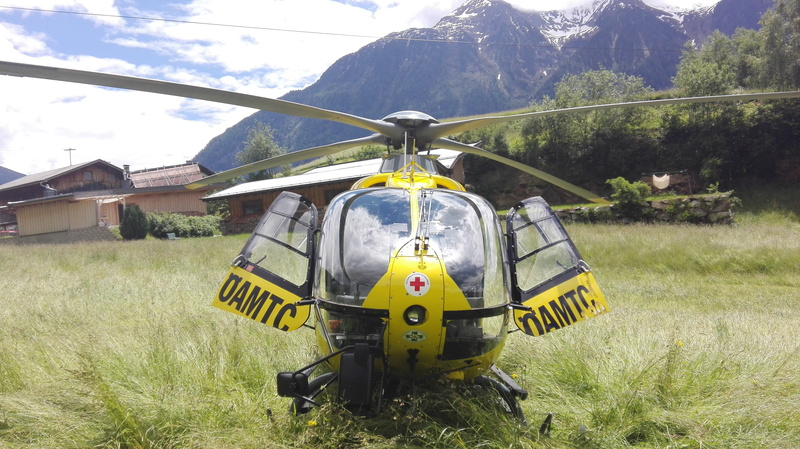 rescue helicopter, mode of transportation, tree, plant, field, rotor, air rescue, no people, christophorus, text, yellow, nature, green color, mountain