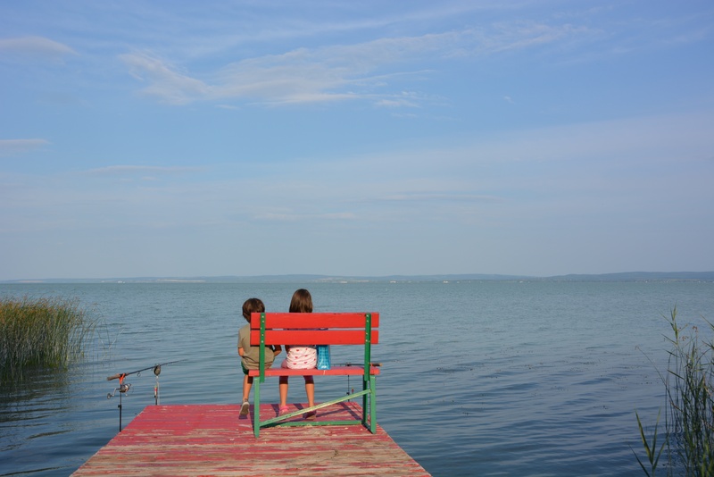 child, sitting, lakeside, wooden, holiday, scenics - nature, girl and boy, water, horizon, women, dreams, 4K, bridge, lake, green, together, lifestyles