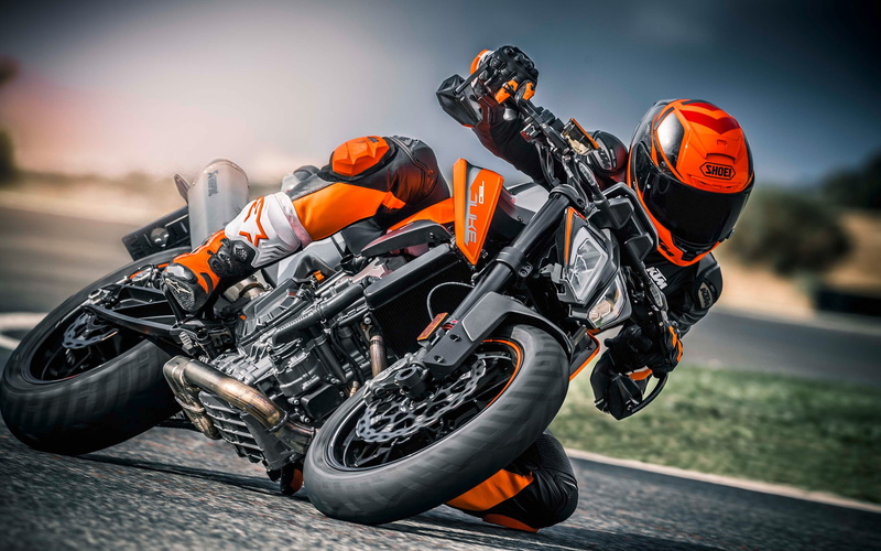 Vehicle, headwear, motorsport, ktm 790 duke, sports helmet, people, sports race, riding, real people, outdoors, orange color, orange, motorcycle racing