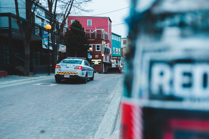 transportation, pavement, automobile, tarmac, outdoors, building, city, machine, van, day, land vehicle, city street, license plate, asphalt, wheel, building exterior
