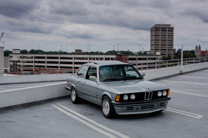 urban, vintage, classic, car, gray, building exterior, architecture, road, motor vehicle, building, garage, no people, coupe, street, day, rooftop, benz