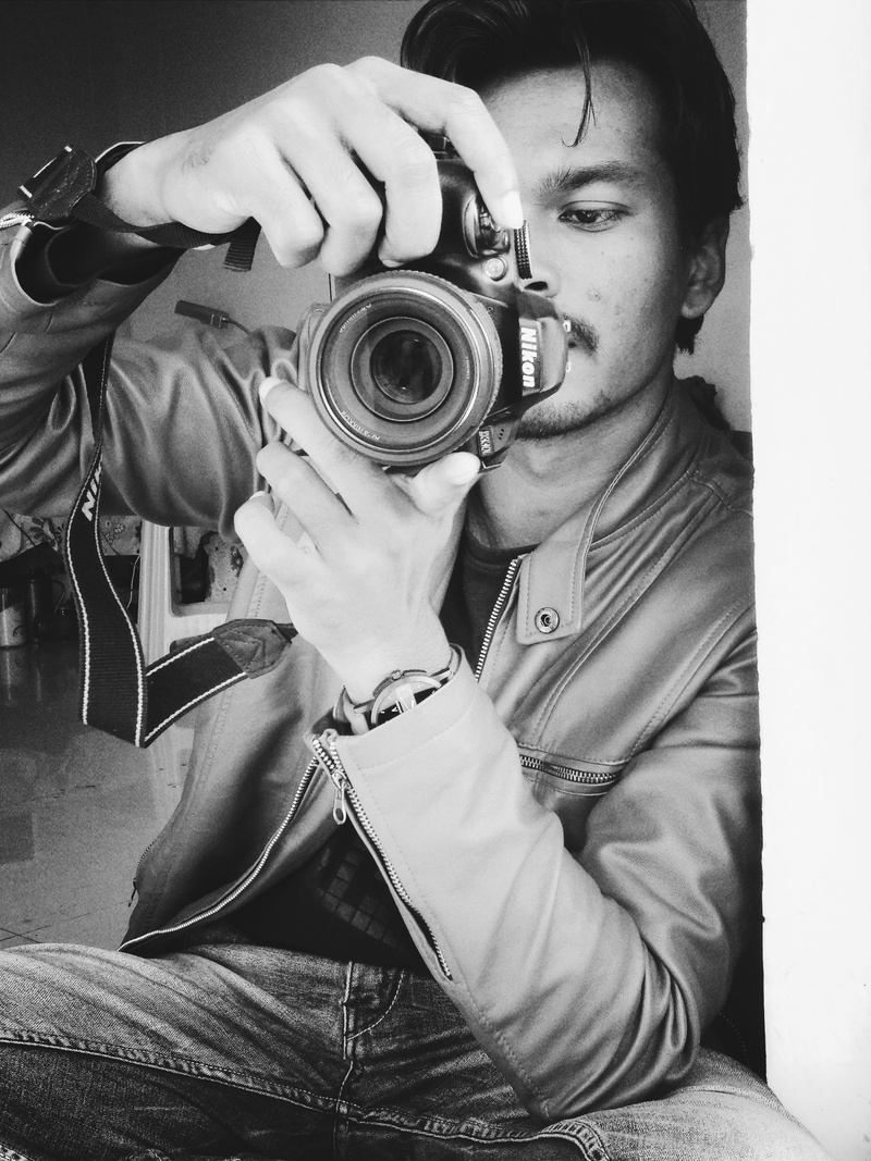 leather jacket, person, lens, portrait, photography themes, male, technology, front view, one person, 4K, hands, holding, nikon, monochrome, sit, digital camera
