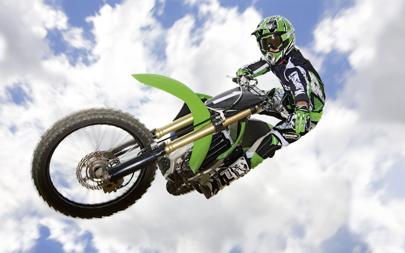 fun, outdoors, motorcycle, protective Sportswear, exhilaration, motorcycle Racing, stunt, sports Race, nature, action, mid-air, green, cloud - sky, extreme