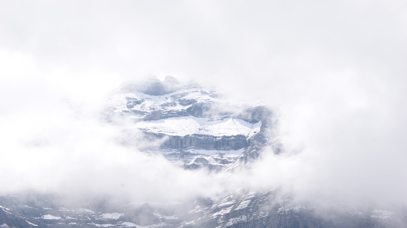 rock, clouds, eiger, mountain, no people, tranquility, snowing, fog, mountain peak, beauty in nature, snow, outdoors, snowcapped mountain, environment