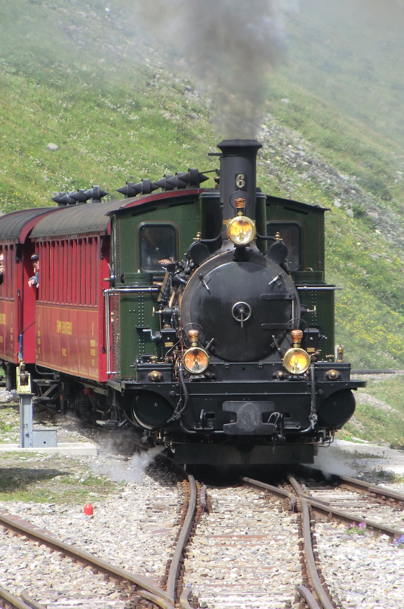mode of transportation, land vehicle, railroad car, outdoors, train, passenger train, shunting yard, nature, rail transportation, locomotive, travel, steam train