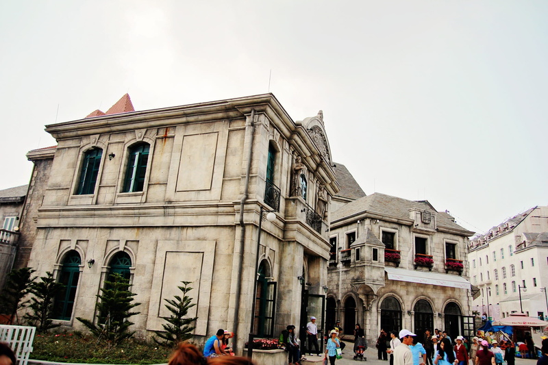 built structure, women, religion, ba na hill, clear sky, lifestyles, group of people, day, outdoors, vietnam, real people, history, large group of people