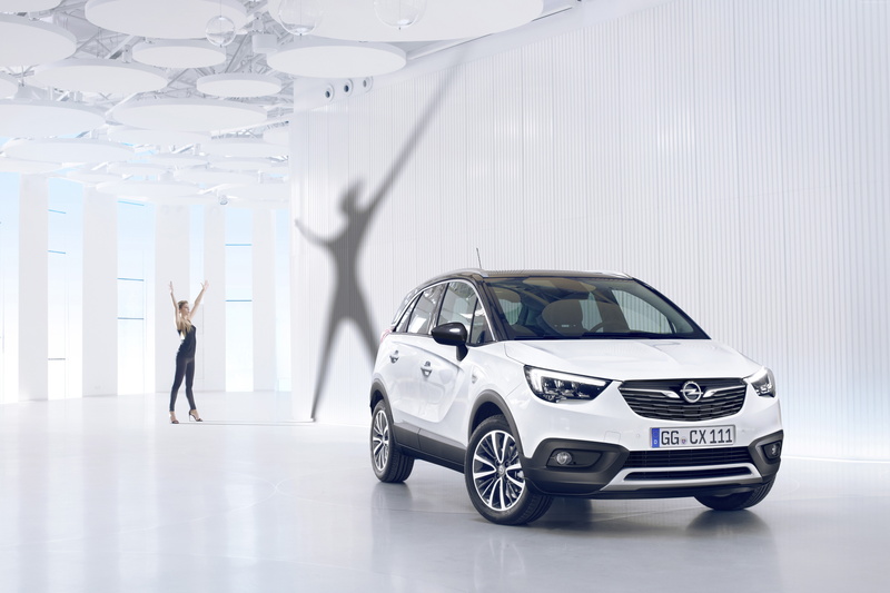 motor vehicle, young adult, car, clothing, occupation, front view, adult, land vehicle, indoors, women, CES 2017, crossover, standing, transportation, one person
