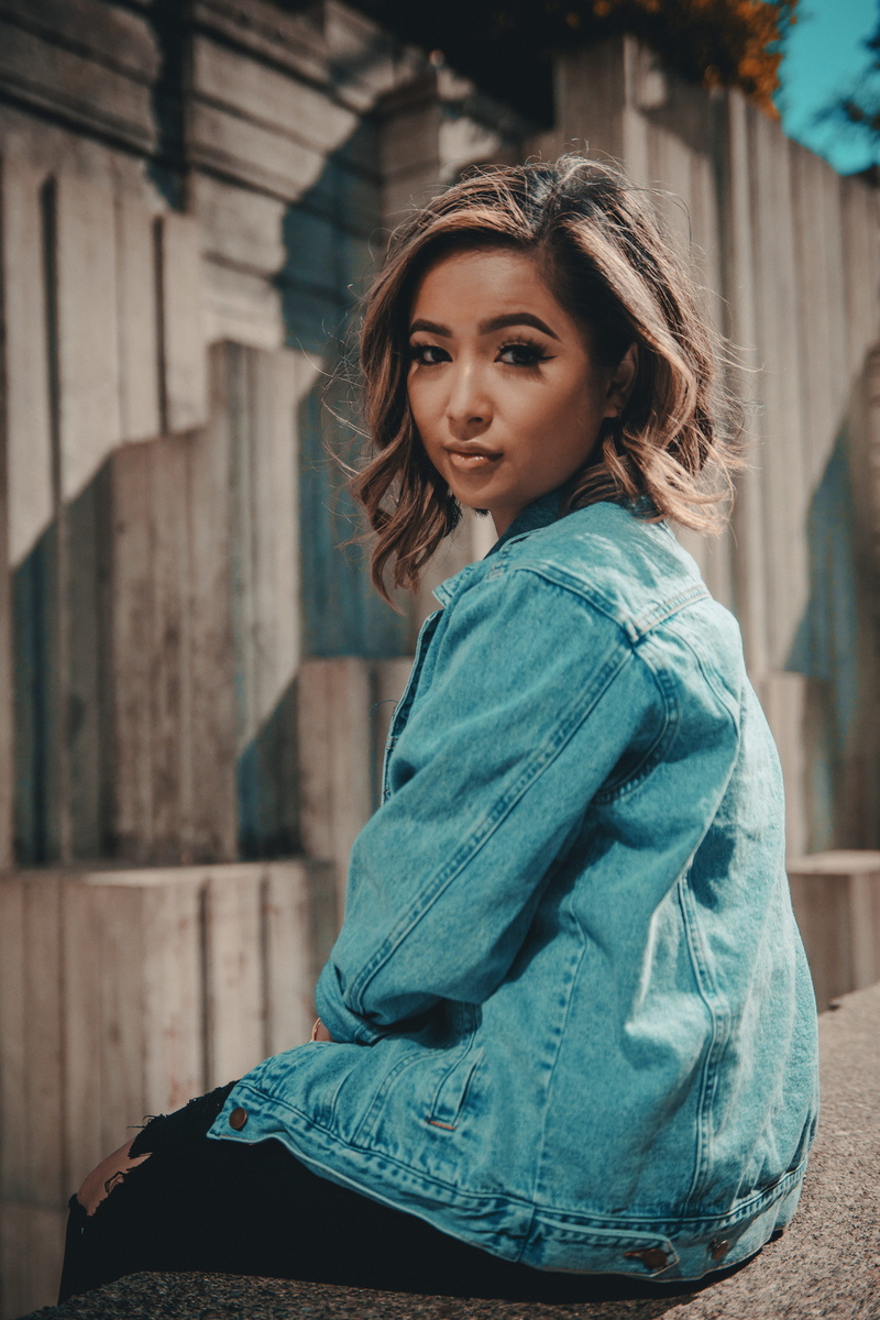 casual clothing, side view, beautiful woman, street portrait, looking at camera, seattle, young adult, man, concrete, woman, dayime, one person, wearing