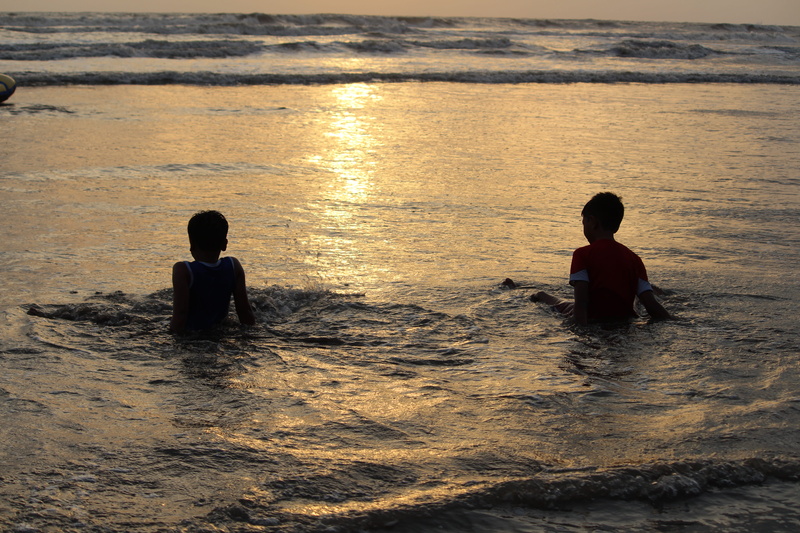 childhood, outdoors, waterfront, #godothegreat, sitting, maharashtra, sunshine, males, leisure activity, brotherhood, india, splash, togetherness, play