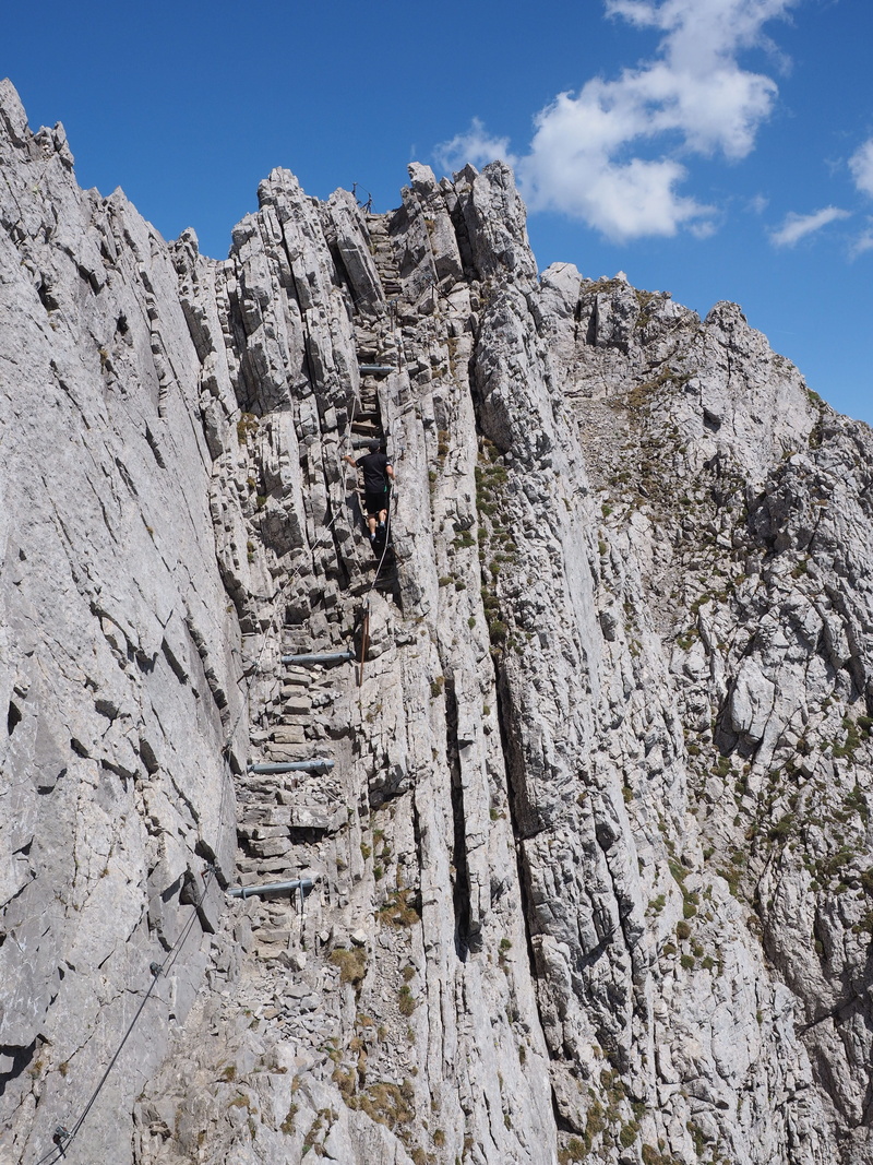 day, the rope, low angle view, mountain peak, non-urban scene, sky, physical geography, geology, no people, rocky mountains, sunlight, nature, swiss alps