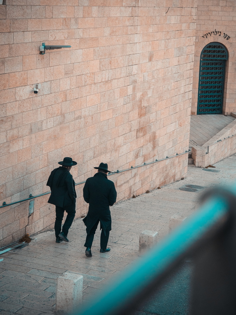 hebrew, two people, pathway, 4K, suit, brick wall, day, path, walkway, apparel, wearing, architecture, hat, black, two, overcoat, building exterior, walking cane