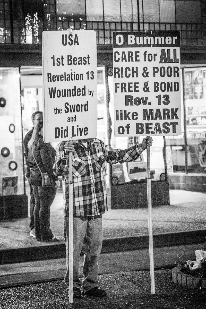 protest, the sign holder, human, crowd, script, san francisco, information, face, front, message, man, day, clothing, shoe, holding, information sign, apparel
