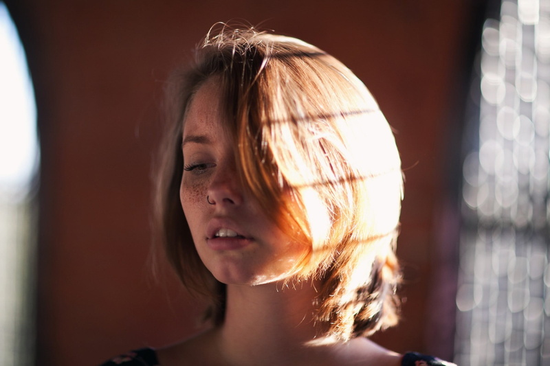 women, lifestyles, portrait, young women, sunlight, beautiful woman, indoors, nose rings, 1080P, looking away, hair, headshot, contemplation, hair in face