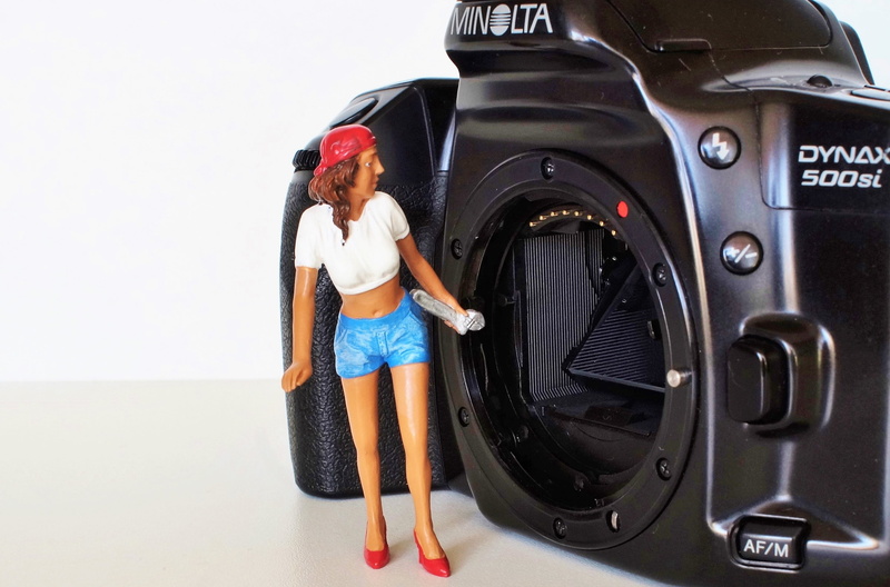 setting mirror, 500si, leisure activity, one Person, old camera, holding, photography, young women, konica, equipment, mode of transportation, young Adult