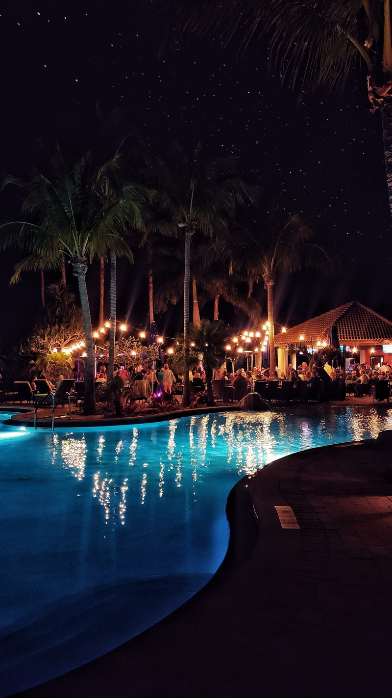 resort, outdoors, standing, city, architecture, lighting equipment, 4K, illuminated, glowing, town, sea, pool, tree, sky, summer, club, night, no people