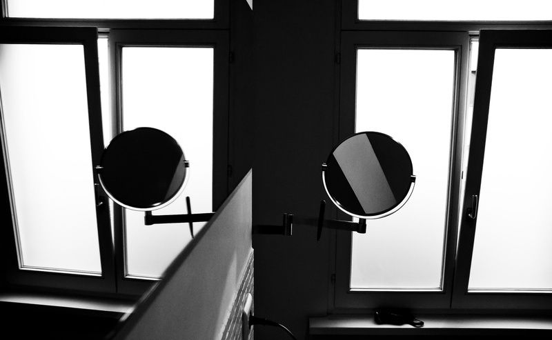 white, window, mounted, circle, glass - material, safety, road sign, mirror, sign, day, building, lighting equipment, built structure, no people, wall
