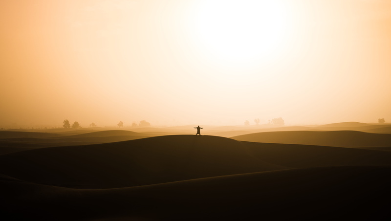 yellow, solitude, yoga, hill, distant, standing, tranquility, one person, sunrise, sahara, scenics - nature, earth, non-urban scene, orange color, desert
