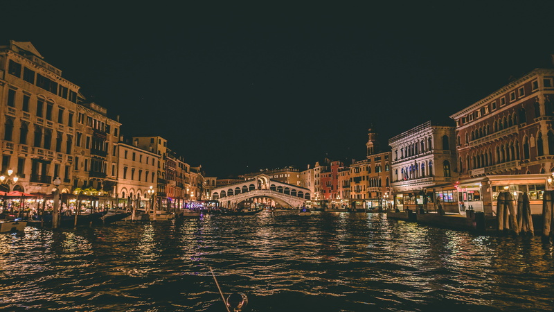 city, waterfront, water, italy, famous, night, outdoors, gondola, illuminated, travel, building exterior, transportation, beside, mode of transportation