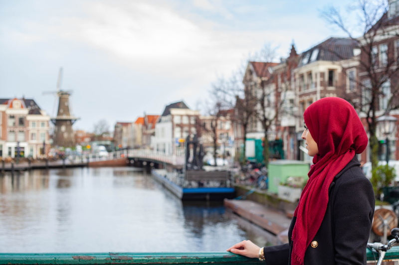 transportation, women, concrete, building, outdoors, canal, girl, woman, muslim, side view, netherlands, windmill, waist up, hijab, cityscape, street, trees