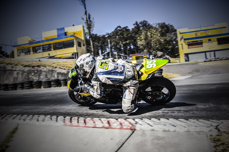 buildings, motorcycle, racer, helmet, motor vehicle, wheels, plant, driver, crash helmet, nature, mode of transportation, sport, fast, sports, machine
