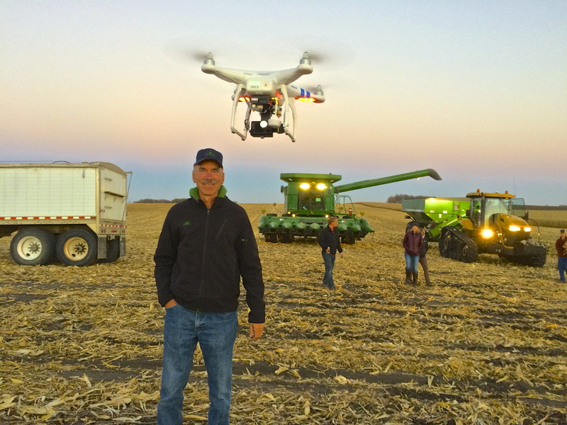 mid-air, group of people, incidental people, looking at camera, drone, farm, united states, sky, corn, land, mode of transportation, airport, work, real people