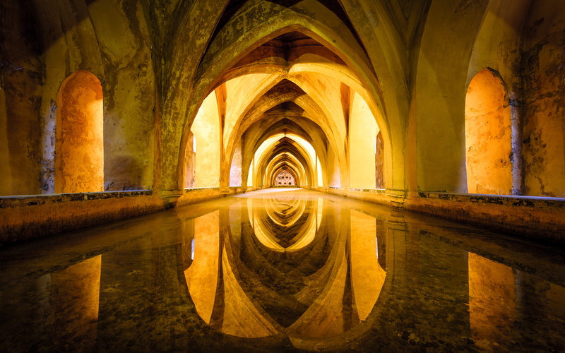 illuminated, history, photography, yellow, old, orange, baths, architecture, travel destinations, sevilla, spain, indoors, reflection, religion, water