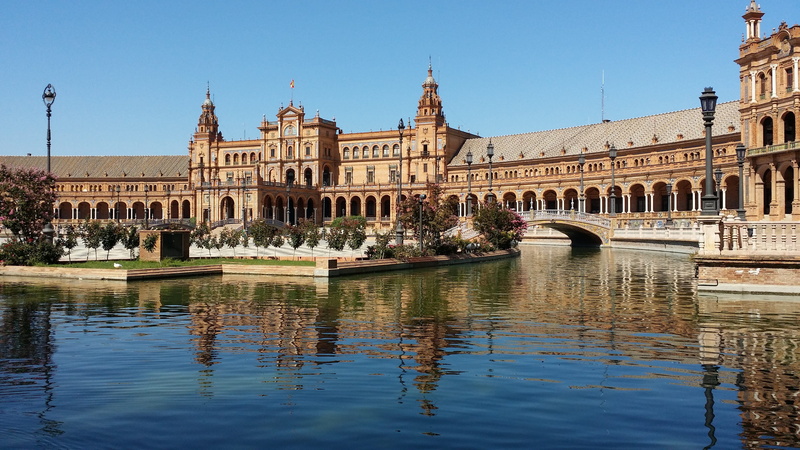 sevilla, the past, building, incidental people, reflection, city, plaza despaña, spain, travel destinations, travel, day, government, clear sky, water